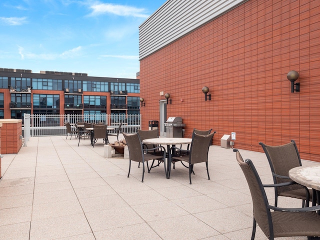 215 10th Ave S Unit 112, Minneapolis, MN 55415 - view of patio / terrace with outdoor dining area and area for grilling