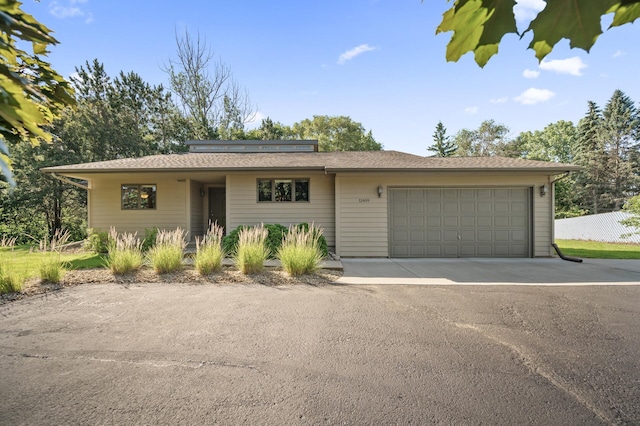 11409 Bren Rd, Minnetonka, MN 55343 - ranch-style home with an attached garage and driveway