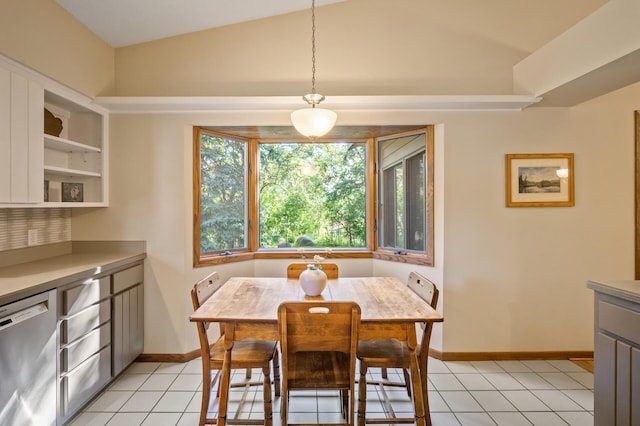 11409 Bren Rd, Minnetonka, MN 55343 - dining area featuring light tile patterned floors and vaulted ceiling