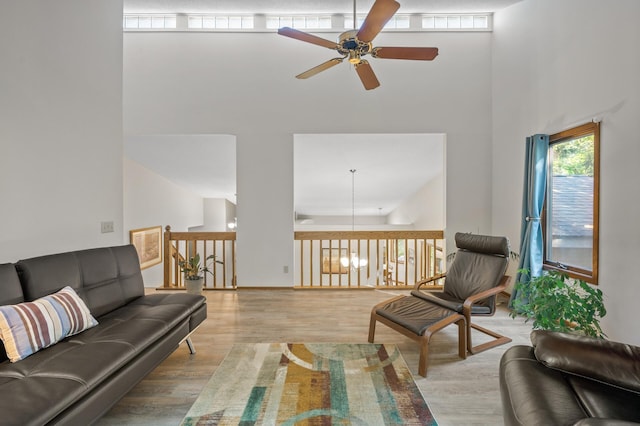 11409 Bren Rd, Minnetonka, MN 55343 - living room featuring a high ceiling, ceiling fan, and light wood-type flooring