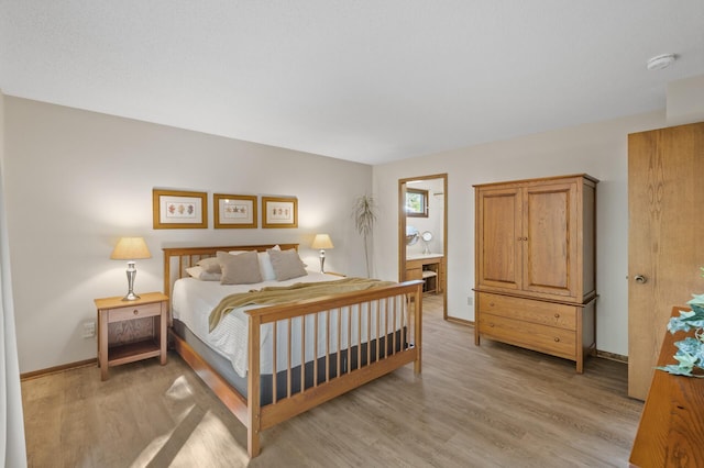 11409 Bren Rd, Minnetonka, MN 55343 - bedroom featuring light wood-style floors and baseboards