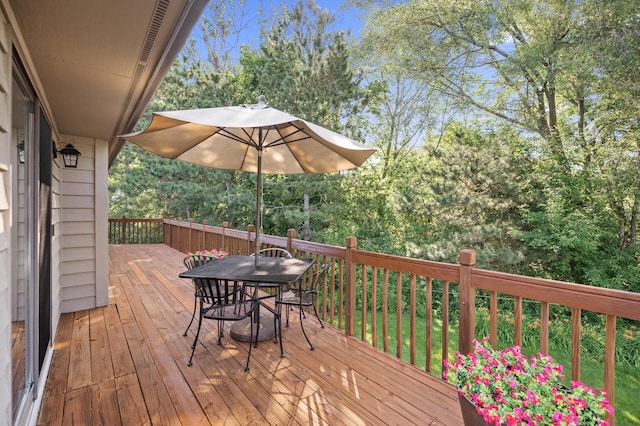 11409 Bren Rd, Minnetonka, MN 55343 - wooden terrace with outdoor dining area and view of scattered trees