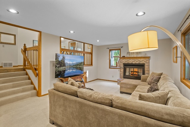 11409 Bren Rd, Minnetonka, MN 55343 - living area with light carpet, recessed lighting, stairs, and a brick fireplace