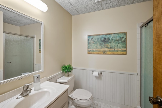 11409 Bren Rd, Minnetonka, MN 55343 - full bathroom featuring a wainscoted wall, an enclosed shower, vanity, and tile patterned floors