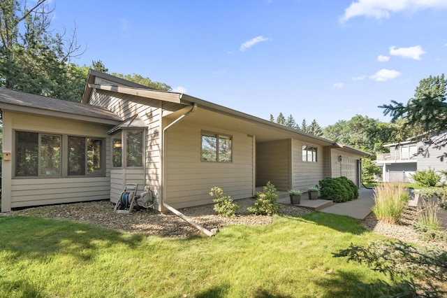 11409 Bren Rd, Minnetonka, MN 55343 - rear view of property featuring a yard