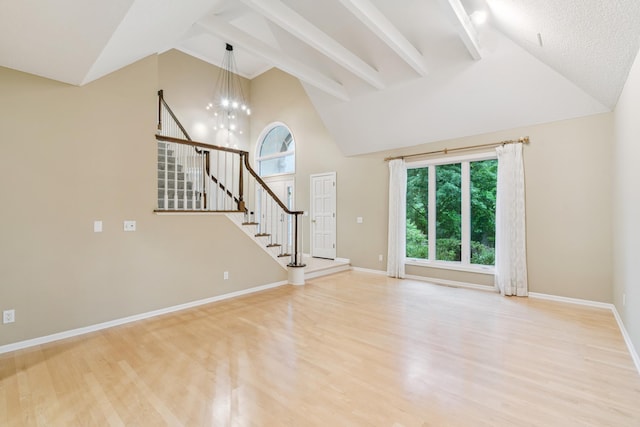 7005 Valley View Rd, Edina, MN 55439 - unfurnished living room with high vaulted ceiling, wood finished floors, a chandelier, beamed ceiling, and stairway