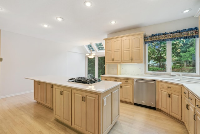 7005 Valley View Rd, Edina, MN 55439 - kitchen with stainless steel dishwasher, light brown cabinetry, light wood-type flooring, light countertops, and recessed lighting