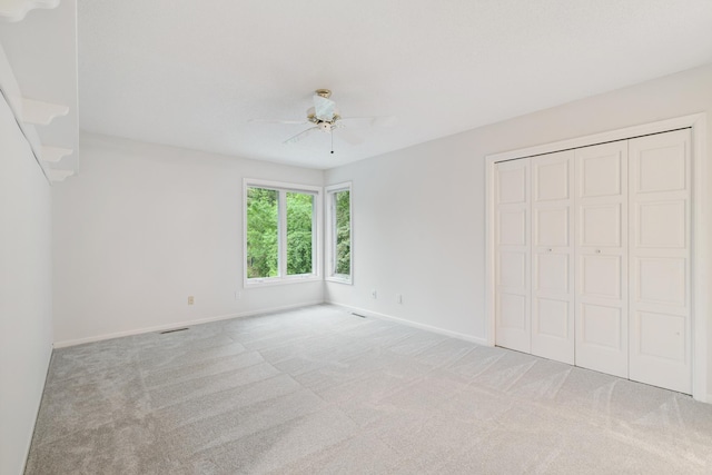 7005 Valley View Rd, Edina, MN 55439 - unfurnished bedroom featuring carpet, a closet, and ceiling fan