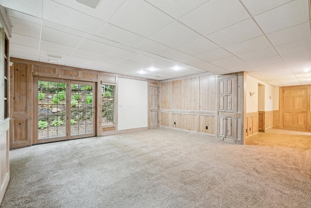 7005 Valley View Rd, Edina, MN 55439 - carpeted empty room with wood walls and a drop ceiling