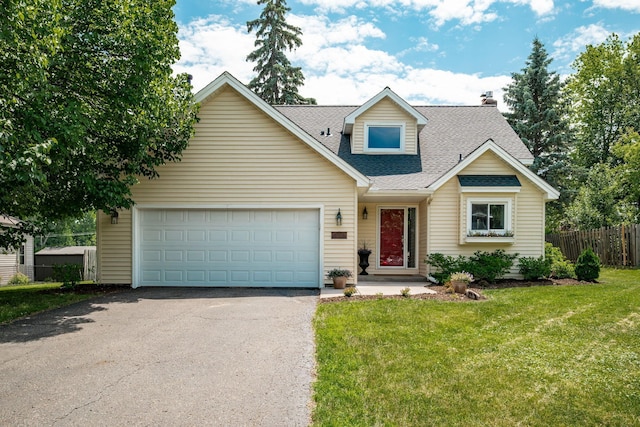 16391 Adret Ct, Eden Prairie, MN 55346 - view of front of property featuring asphalt driveway, roof with shingles, and a garage