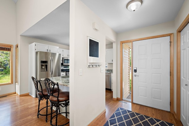16391 Adret Ct, Eden Prairie, MN 55346 - entryway featuring light wood-style flooring