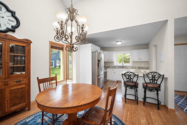 16391 Adret Ct, Eden Prairie, MN 55346 - dining space with a chandelier and wood finished floors