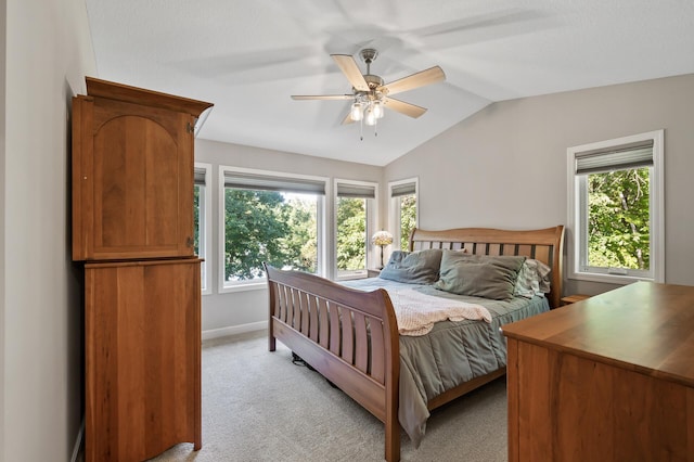 27858 Nathan Ln, Chisago Lake Twp, MN 55045 - bedroom featuring multiple windows, lofted ceiling, light colored carpet, and a ceiling fan