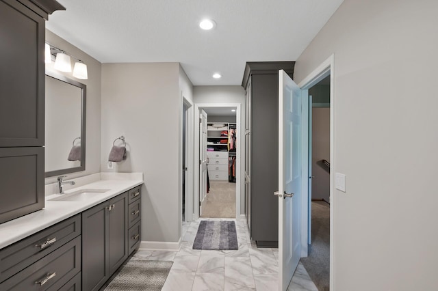 27858 Nathan Ln, Chisago Lake Twp, MN 55045 - full bathroom with marble look tiles, vanity, a spacious closet, and recessed lighting