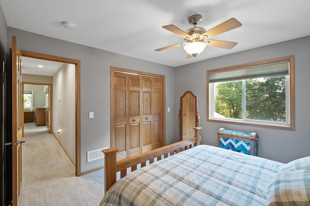 27858 Nathan Ln, Chisago Lake Twp, MN 55045 - bedroom featuring light carpet, a closet, and ceiling fan