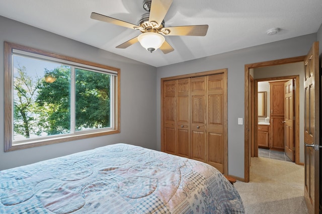 27858 Nathan Ln, Chisago Lake Twp, MN 55045 - bedroom featuring light carpet, a closet, and ceiling fan
