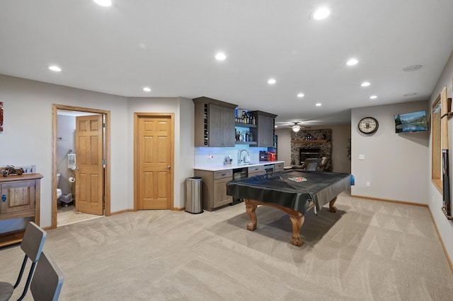 27858 Nathan Ln, Chisago Lake Twp, MN 55045 - game room with recessed lighting, wet bar, a large fireplace, light carpet, and ceiling fan