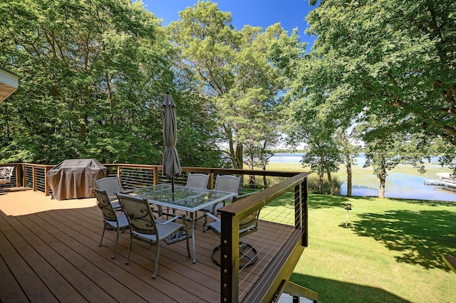 27858 Nathan Ln, Chisago Lake Twp, MN 55045 - wooden terrace featuring grilling area, outdoor dining area, a water view, and a lawn