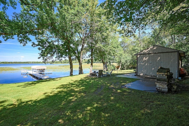 27858 Nathan Ln, Chisago Lake Twp, MN 55045 - view of green lawn with a boat dock, a water view, and a storage unit