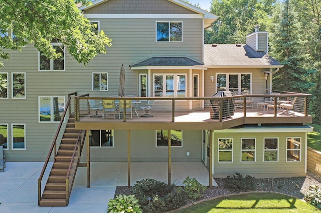 27858 Nathan Ln, Chisago Lake Twp, MN 55045 - back of property with a patio area, a chimney, a wooden deck, and stairs