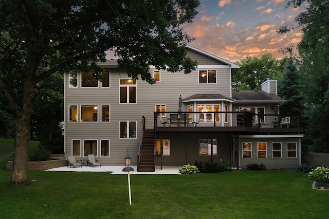 27858 Nathan Ln, Chisago Lake Twp, MN 55045 - back of house featuring a patio, a wooden deck, stairway, and a lawn