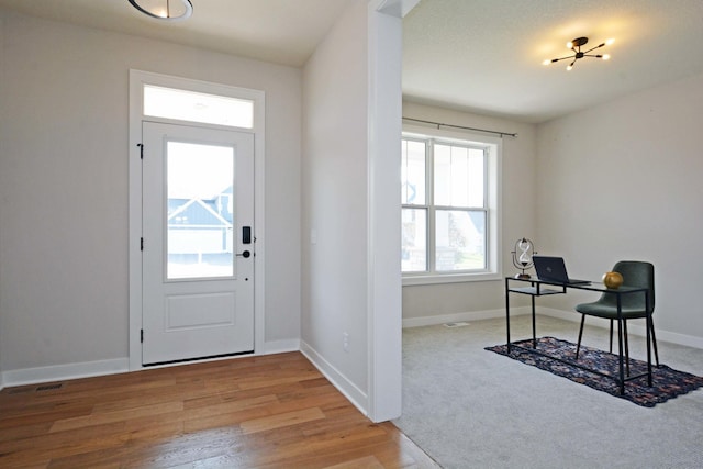 5120 Coronado Dr, Woodbury, MN 55129 - foyer entrance with healthy amount of natural light and wood finished floors