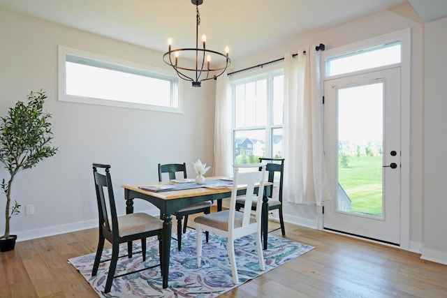 5120 Coronado Dr, Woodbury, MN 55129 - dining area featuring a chandelier and light wood-type flooring