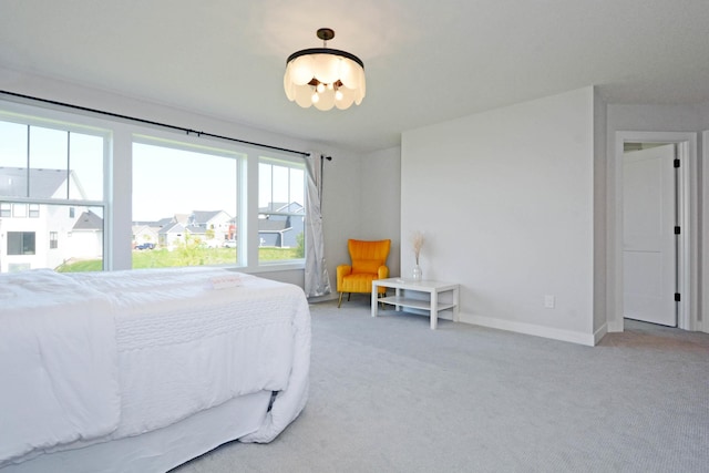 5120 Coronado Dr, Woodbury, MN 55129 - bedroom featuring a chandelier and light carpet