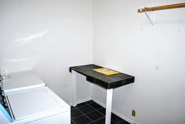 1015 Grove St, Brainerd, MN 56401 - laundry room featuring dark tile patterned flooring and separate washer and dryer