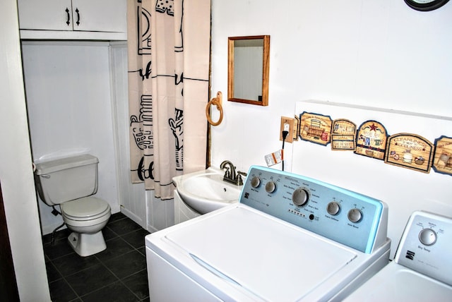 1015 Grove St, Brainerd, MN 56401 - laundry area featuring independent washer and dryer and dark tile patterned flooring