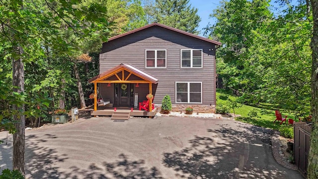 38985 337th Ln, Aitkin, MN 56431 - view of front of house with a deck and stone siding