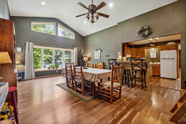 38985 337th Ln, Aitkin, MN 56431 - dining room with a ceiling fan, hardwood / wood-style floors, high vaulted ceiling, and recessed lighting