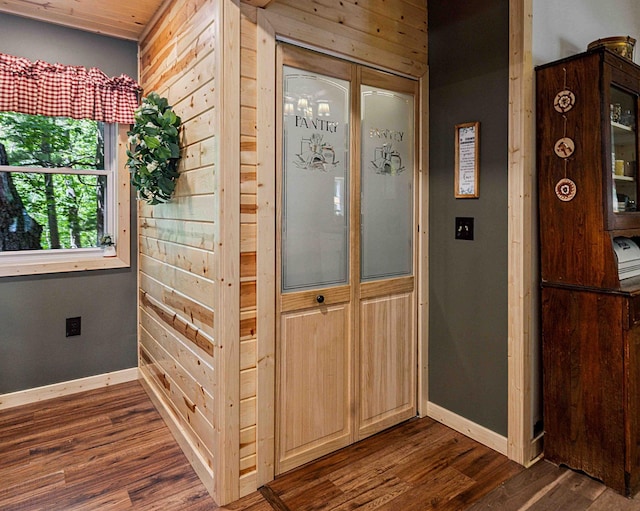 38985 337th Ln, Aitkin, MN 56431 - foyer with dark wood-type flooring and wooden walls