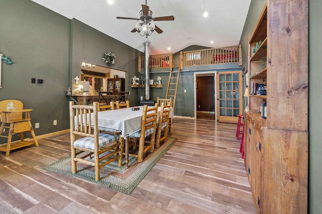 38985 337th Ln, Aitkin, MN 56431 - dining area featuring ceiling fan, wood finished floors, french doors, and high vaulted ceiling