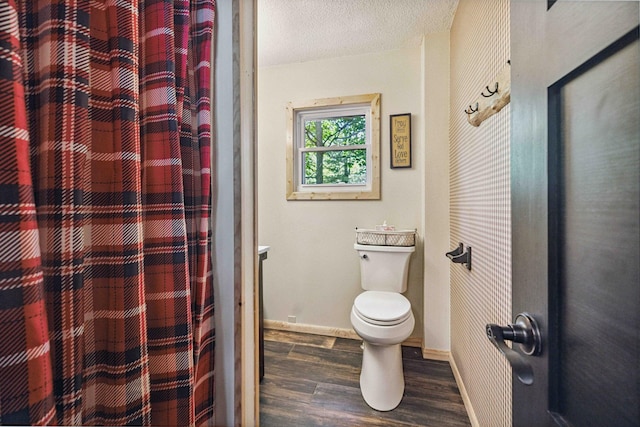 38985 337th Ln, Aitkin, MN 56431 - bathroom with wood finished floors, a shower with shower curtain, and a textured ceiling