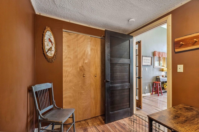38985 337th Ln, Aitkin, MN 56431 - sitting room featuring wood finished floors, a textured ceiling, and french doors