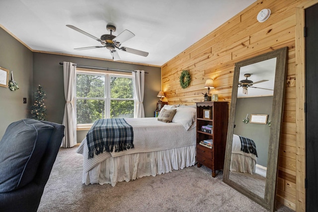 38985 337th Ln, Aitkin, MN 56431 - carpeted bedroom featuring wood walls and a ceiling fan