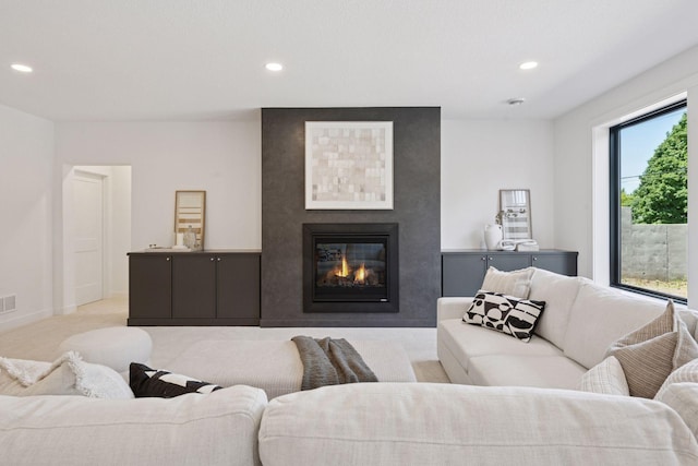 4404 58th St, Edina, MN 55424 - living room with recessed lighting, a large fireplace, and light colored carpet