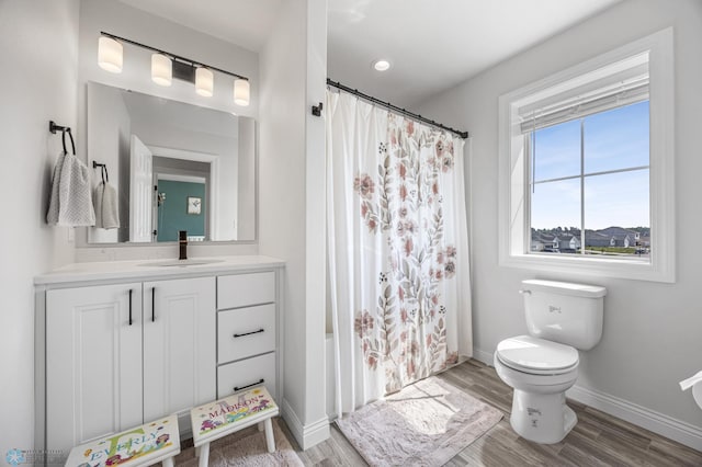 8871 Cottonwood Blvd, Horace, ND 58047 - bathroom featuring vanity, wood finished floors, and shower / tub combo with curtain