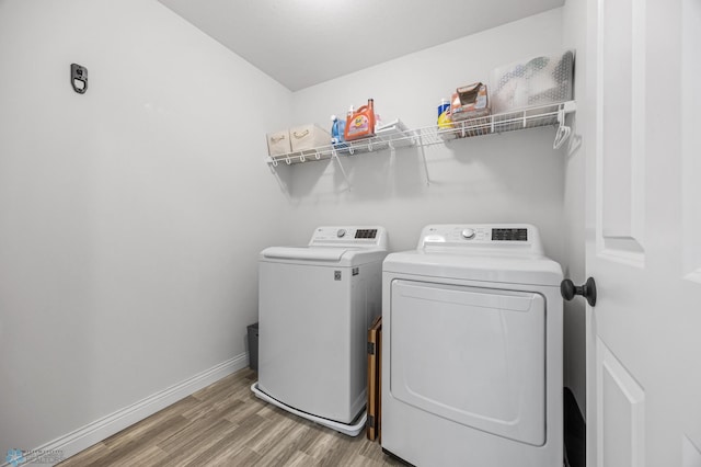 8871 Cottonwood Blvd, Horace, ND 58047 - laundry room with washing machine and clothes dryer and light wood-type flooring