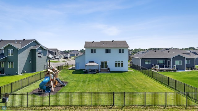 8871 Cottonwood Blvd, Horace, ND 58047 - back of house with a residential view, a playground, and a fenced backyard