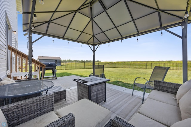 8871 Cottonwood Blvd, Horace, ND 58047 - wooden deck with a view of countryside, a fenced backyard, outdoor lounge area, and area for grilling