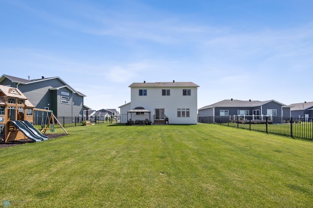 8871 Cottonwood Blvd, Horace, ND 58047 - rear view of house featuring a gazebo, a fenced backyard, a playground, and a residential view