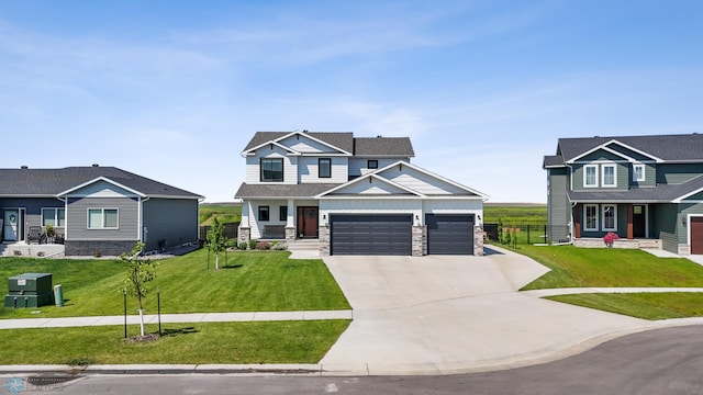 8871 Cottonwood Blvd, Horace, ND 58047 - craftsman-style home featuring driveway, covered porch, an attached garage, and stone siding