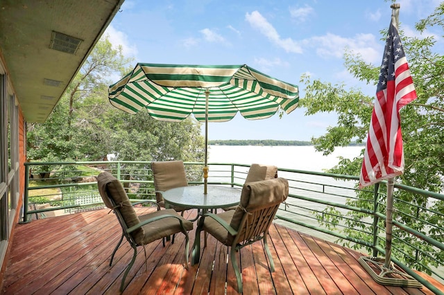 24301 Cedar Lake Dr, Helena Twp, MN 56071 - wooden terrace featuring a water view and outdoor dining area