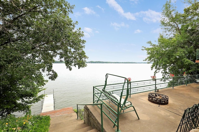 24301 Cedar Lake Dr, Helena Twp, MN 56071 - dock area with a water view and an outdoor fire pit