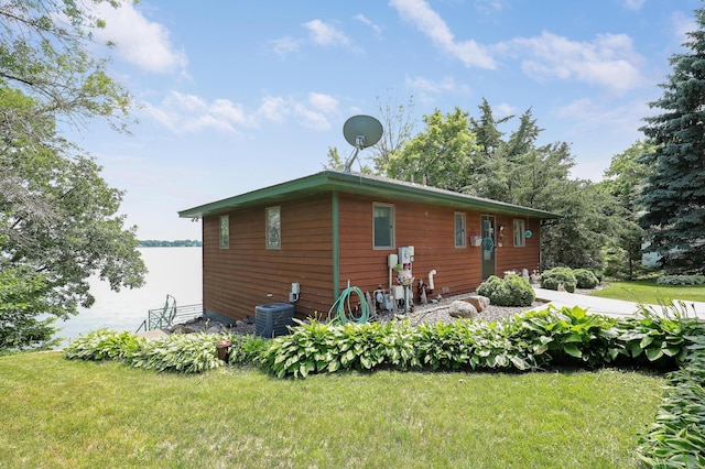 24301 Cedar Lake Dr, Helena Twp, MN 56071 - view of side of home with a yard and a water view