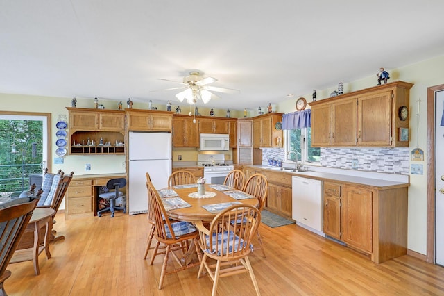 24301 Cedar Lake Dr, Helena Twp, MN 56071 - kitchen with white appliances, plenty of natural light, light wood-style floors, and an office area
