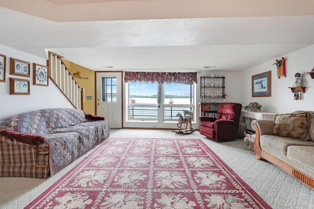 24301 Cedar Lake Dr, Helena Twp, MN 56071 - living room with light carpet, a water view, and stairs