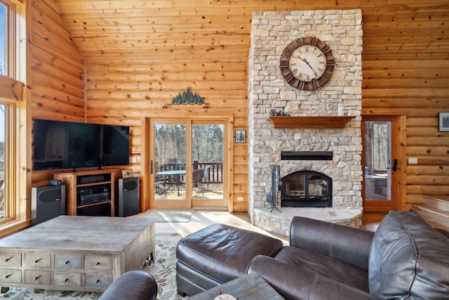 15193 Wilderness Trl, Crosslake, MN 56442 - living area featuring log walls, high vaulted ceiling, a fireplace, wooden ceiling, and wood finished floors